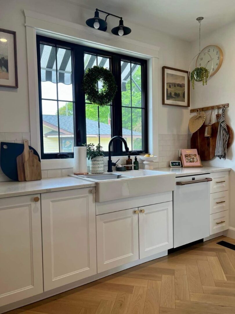 A kitchen with white cabinets